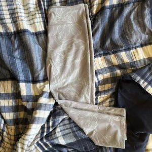 Theses are legging from fabletics size medium color is Gary with flowers outline